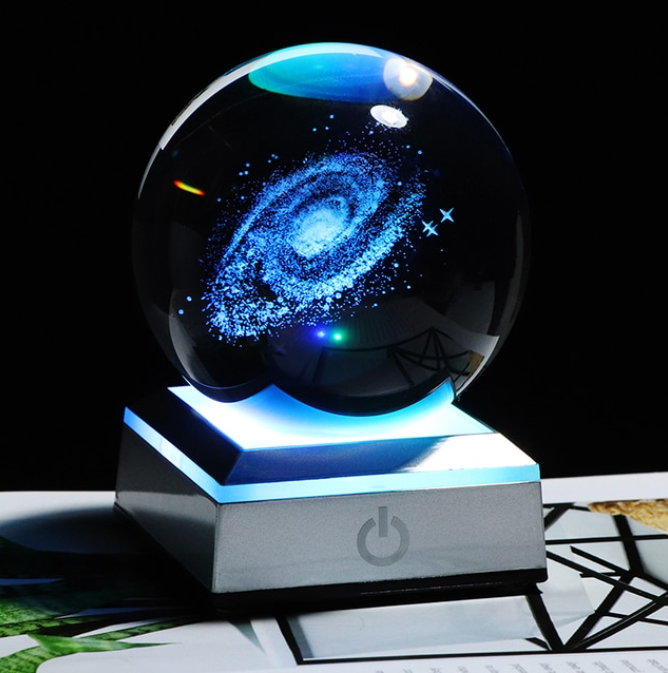 This 3D Galaxy Miniature Crystal Ball is just what you need to add a touch of elegance and class to your home décor. It is made of high-quality K9 crystal that makes it durable and long lasting. The beautiful transparency of the crystal ball gives it a magnificent look that is sure to grab everyone's attention.
